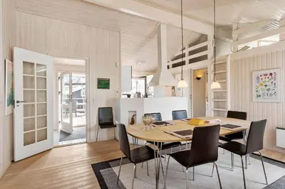 a dining room with a table and chairs at BL1461-Saltum-Kvansletten-29 in Saltum