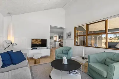 a living room with a couch and chairs and a table at BL980-Saltum-Faarup-Klitvej-46 in Saltum