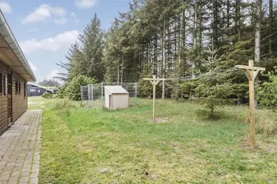 a yard with a fence and a basketball hoop at BL308-Saltum-Laustvej-24 in Saltum
