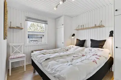 a large bed in a room with a window at BL1408-Pandrup-Hunetorp-Klitvej-243 in Pandrup