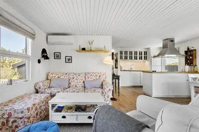 a living room with a couch and a table at BL1408-Pandrup-Hunetorp-Klitvej-243 in Pandrup
