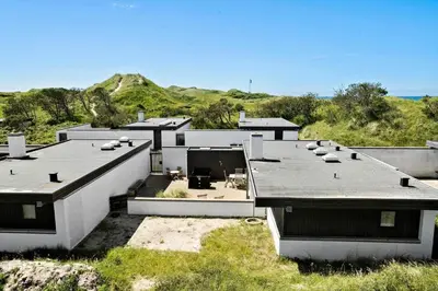 an aerial view of a house with a roof at BL1398-Pandrup-Rodhus-Klitvej-135 in Pandrup