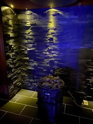 a barrel in a room with a stone wall at BL425-Saltum-Tippen-22 in Saltum