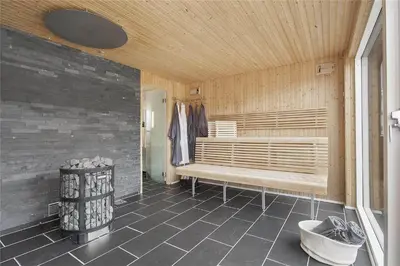 a sauna with a bench in a room at BL425-Saltum-Tippen-22 in Saltum