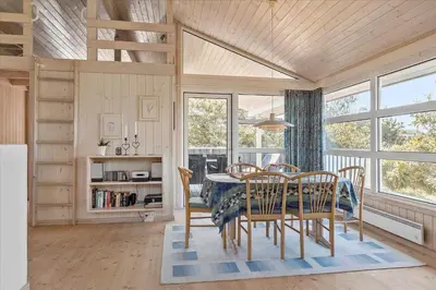 a dining room with a table and chairs at BL152-Saltum-Kvansletten-33 in Saltum