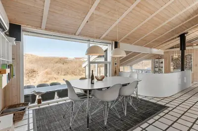 a dining room with a table and chairs at BL1047-Saltum-Bag-Havstokken-2-A in Saltum