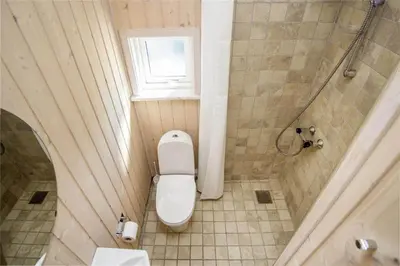 a small bathroom with a toilet and a shower at BL486-Saltum-Laustvej-32 in Saltum