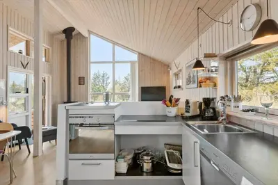 a kitchen with a sink and a counter top at BL1702-Blokhus-Krylevej-3 in Blokhus