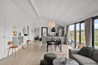 a living room with a couch and a table at BL1411-Blokhus-Ribergaardsvej-15 in Blokhus
