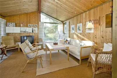 a living room with a couch and a table and chairs at BL363-Saltum-Nyborgvej-4 in Saltum