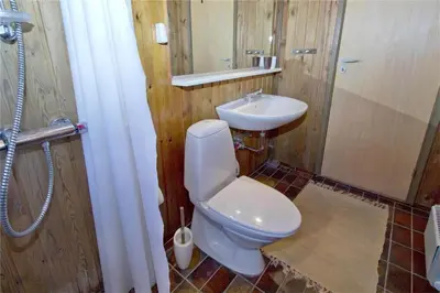 a bathroom with a toilet and a sink at BL363-Saltum-Nyborgvej-4 in Saltum