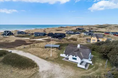 an aerial view of a house on the beach at BL1449-Blokhus-Kienersvej-8 in Blokhus