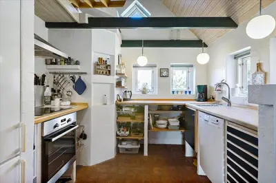 a kitchen with a sink and a counter top at BL1449-Blokhus-Kienersvej-8 in Blokhus
