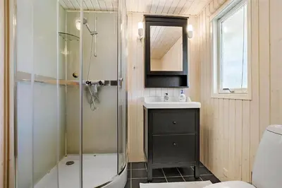 a bathroom with a shower and a sink at BL1066-Pandrup-Rodhus-Skolevej-17 in Pandrup