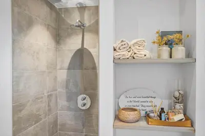a bathroom with a shower with a glass door at BL1427-Blokhus-Ovesensvej-9 in Blokhus
