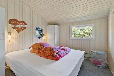 a bedroom with a bed with a pillow on it at BL1625-Saltum-Fladen-Grund-8 in Saltum