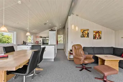 a kitchen and a living room with a table and chairs at BL1625-Saltum-Fladen-Grund-8 in Saltum