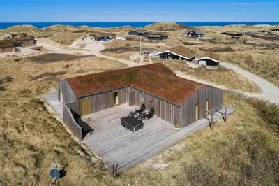 an overhead view of a wooden house with a roof at BL1350-Blokhus-Taarnfalkevej-29 in Blokhus