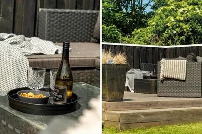 a bottle of wine and a bowl of food on a table at BL1336-Blokhus-Berberisvej-18 in Blokhus