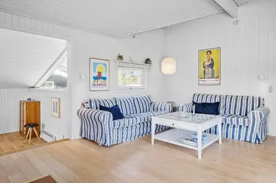 a living room with two couches and a table at BL112-Saltum-Kvansletten-20 in Saltum