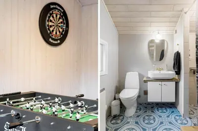 a bathroom with a dart board on the wall at BL1254-Pandrup-Rodhusparken-25 in Pandrup