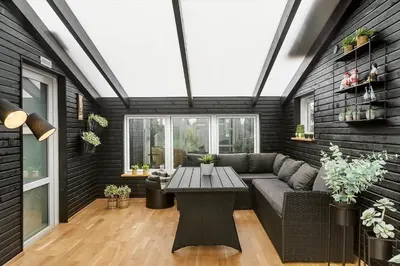 a living room with a couch and a table at BL1515-Blokhus-Peder-Madsensvej-14 in Blokhus