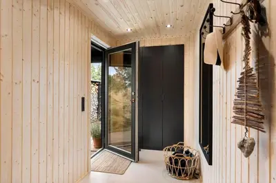 a hallway with a black door in a house at BL1331-Saltum-Tvegen-12 in Saltum