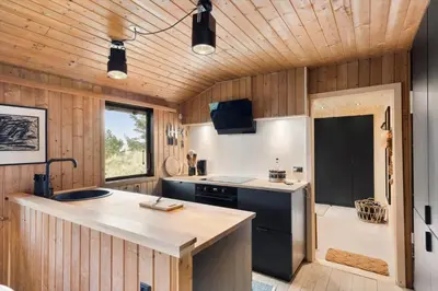 a kitchen with a stove and a sink in a room at BL1331-Saltum-Tvegen-12 in Saltum