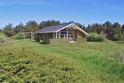 a house in the middle of a field at BL481-Pandrup-Rodhusparken-10 in Pandrup