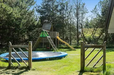 a playground with a slide in a yard at BL714-Saltum-Ornebjergvej-24 in Saltum