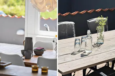 a dining room table with two glass bottles on it at BL1073-Blokhus-Egonsvej-10 in Blokhus