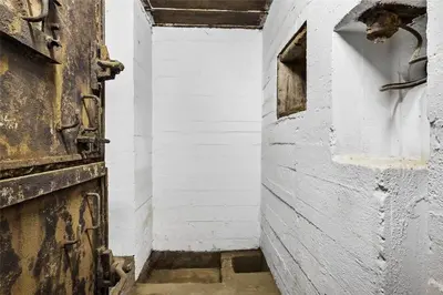 an old door in a room with a white wall at BL1540-Blokhus-Jens-Baerentsvej-14 in Blokhus