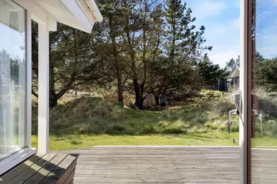 a porch with a bench and a view of a yard at BL1600-Saltum-Daadyrvej-25-A in Saltum