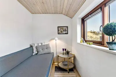 a living room with a couch and a window at BL1733-Blokhus-Dahl-Iversensvej-5 in Blokhus