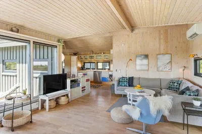 a living room with a couch and a tv at BL1755-Saltum-Karen-Mariesvej-57 in Saltum