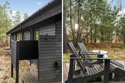 a couple of chairs sitting outside of a cabin at BL1266-Pandrup-Rodhusparken-58 in Pandrup
