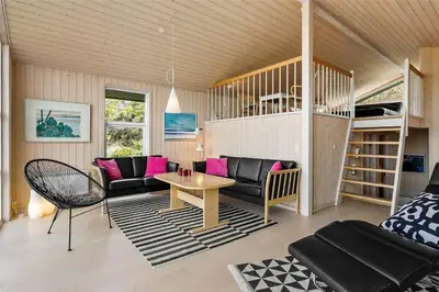 a living room with a couch and a table at BL1281-Saltum-Foraarsvangen-8 in Saltum