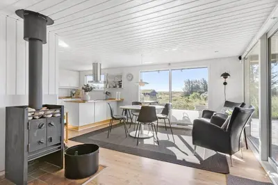 a kitchen and living room with a table and chairs at BL867-Saltum-Karen-Mariesvej-48 in Saltum