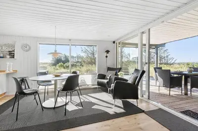 a living room with a table and chairs at BL867-Saltum-Karen-Mariesvej-48 in Saltum