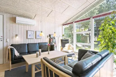 a living room with a couch and a table at BL609-Pandrup-Rodhus-Skolevej-10 in Pandrup