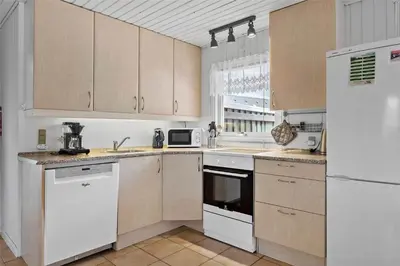 a kitchen with white appliances and a white refrigerator at BL380-Pandrup-Rodhus-Skolevej-1 in Pandrup