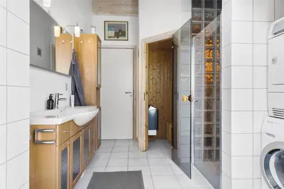 a bathroom with a sink and a washing machine at BL201-Saltum-Kalundborgvej-21 in Saltum