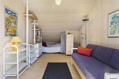 a small room with a couch and a bed at BL201-Saltum-Kalundborgvej-21 in Saltum