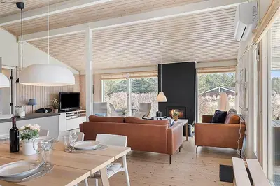 a living room with a couch and a table at BL103-Saltum-Daadyrvej-23-A in Saltum