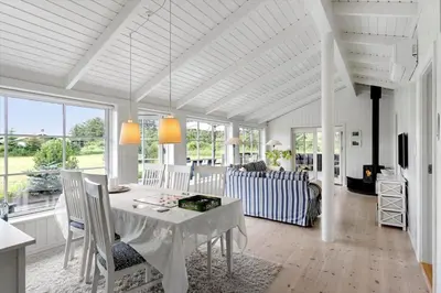 a white living room with a table and chairs at BL653-Saltum-Nordvestvej-27 in Saltum