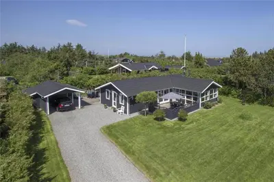 an aerial view of a house with a yard at BL613-Blokhus-Septimusvej-9 in Blokhus