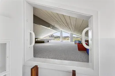 a view of a room through a doorway at BL1555-Blokhus-Egebaeksvej-17 in Blokhus