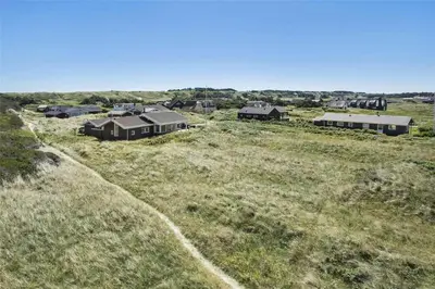 an aerial view of a field with houses at BL1555-Blokhus-Egebaeksvej-17 in Blokhus
