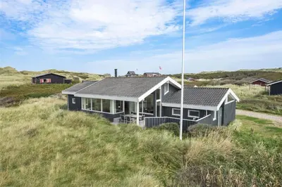 a house in the middle of a field at BL1555-Blokhus-Egebaeksvej-17 in Blokhus