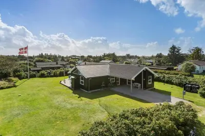 an overhead view of a small house in a yard at BL935-Blokhus-Tobaksvej-1 in Blokhus